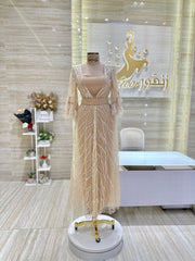 A stunning, knee-length dress with delicate lace details, ideal for celebrating an engagement